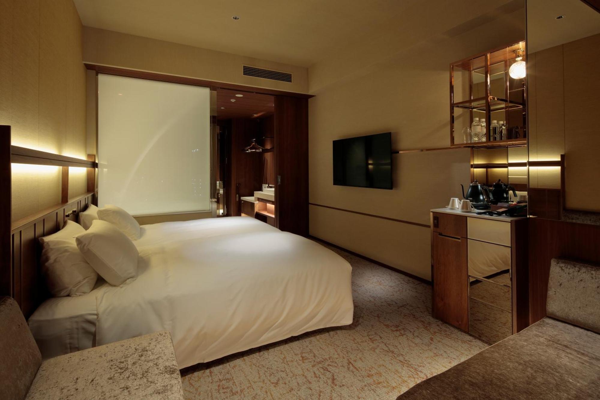 Candeo Hotels Osaka The Tower Zimmer foto A room at the hotel